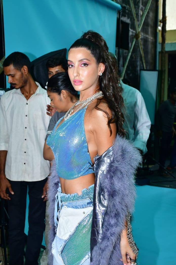 Nora Fatehi was also spotted in this chic shimmery top, making it known that even casual outfits can look amazing with shimmer!